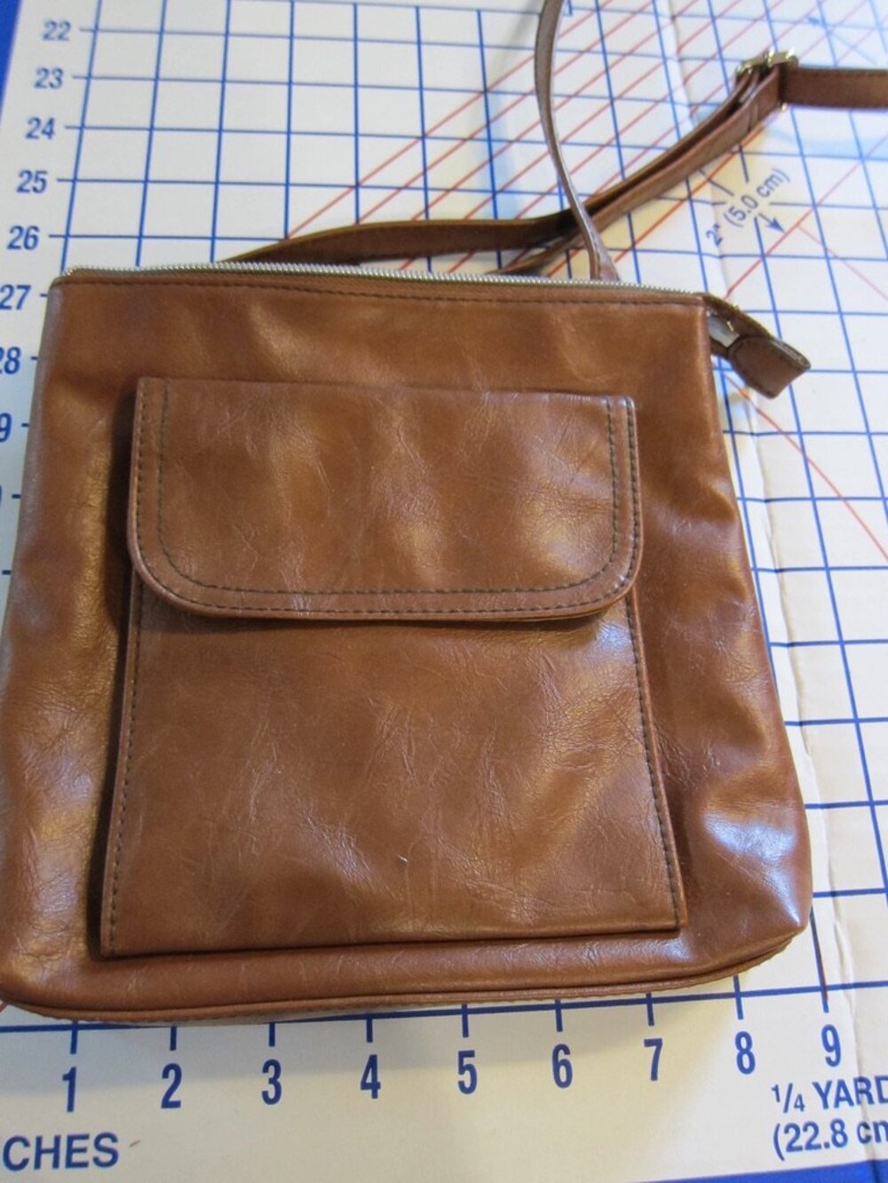 Relic Vegan Leather Erica Mini Crossbody Bag with Zippered opening in Cognac